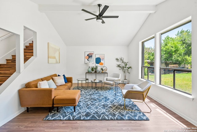 living room with hardwood / wood-style floors, beam ceiling, ceiling fan, and high vaulted ceiling