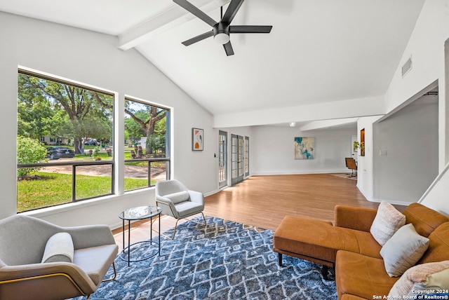 living room with high vaulted ceiling, hardwood / wood-style floors, beam ceiling, and ceiling fan