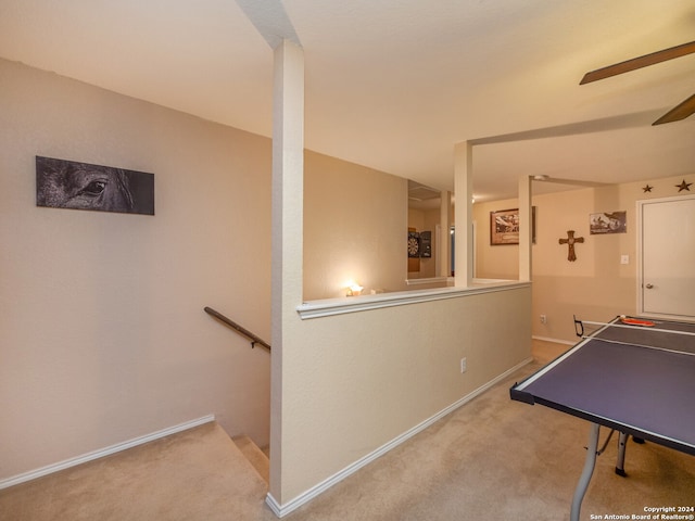 game room with carpet and ceiling fan