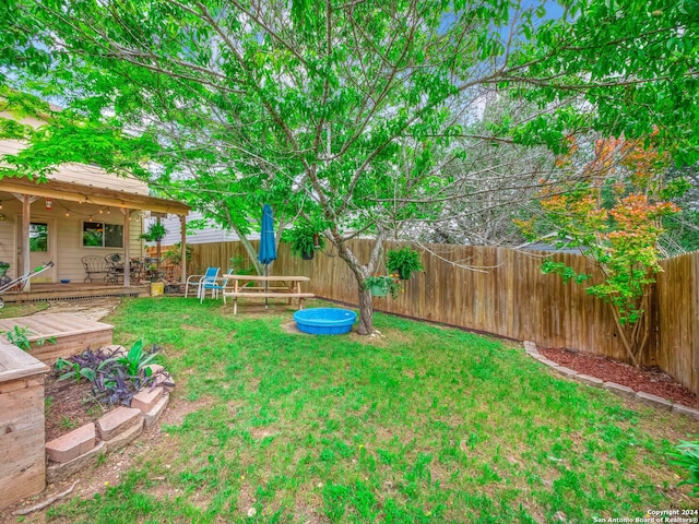 view of yard with a deck