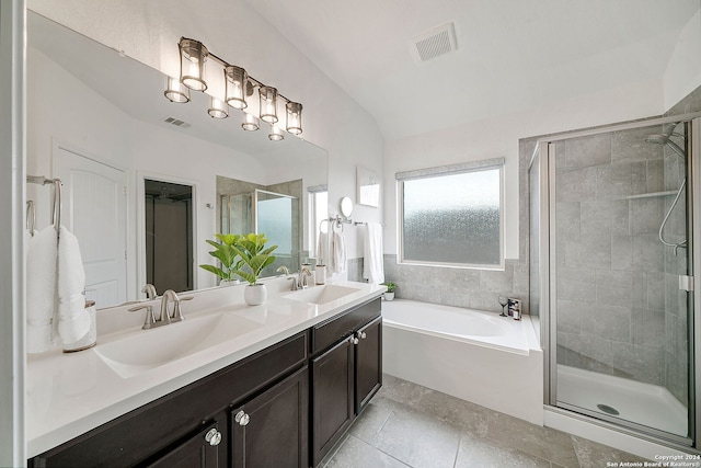 bathroom with dual sinks, shower with separate bathtub, tile flooring, and large vanity