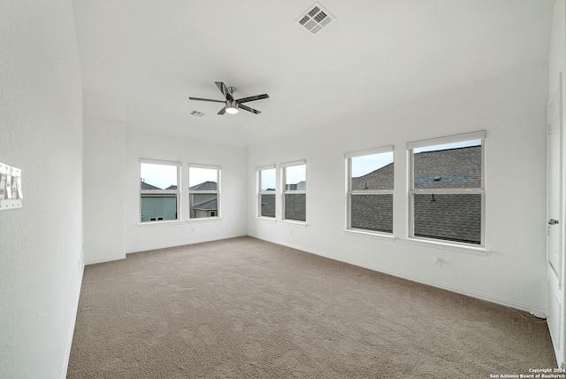 unfurnished room featuring ceiling fan and carpet flooring