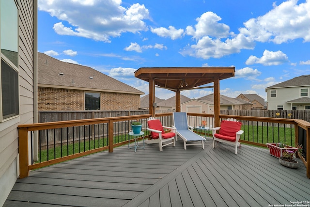 wooden terrace featuring a yard