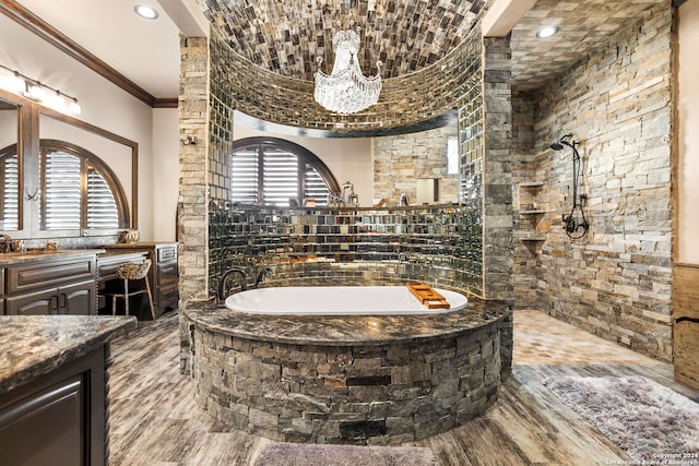 bathroom featuring vanity, shower with separate bathtub, and crown molding