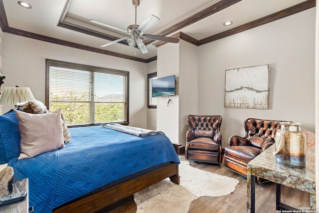 bedroom featuring ceiling fan, hardwood / wood-style flooring, and ornamental molding