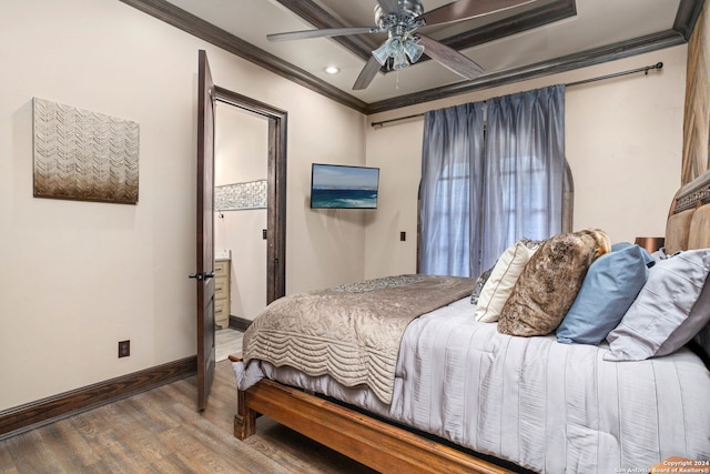 bedroom featuring ornamental molding, dark wood-type flooring, and ceiling fan