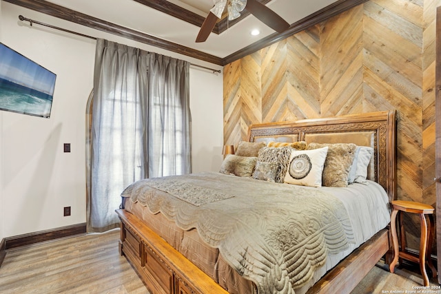 bedroom with ornamental molding, wood-type flooring, and ceiling fan