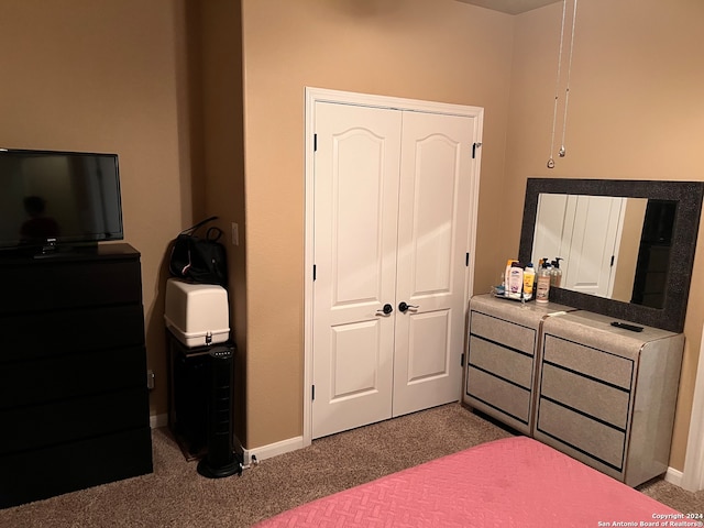 bedroom featuring a closet and carpet flooring