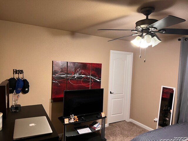 carpeted bedroom with ceiling fan