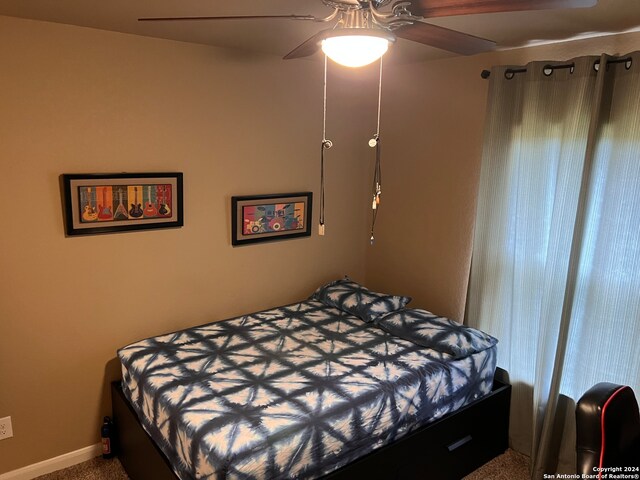 carpeted bedroom with ceiling fan