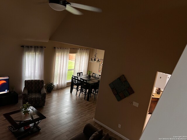 living room featuring high vaulted ceiling, wood-type flooring, and ceiling fan