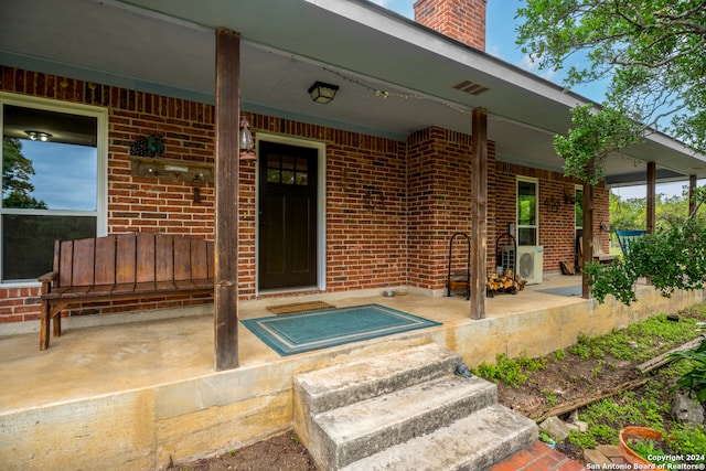 property entrance featuring covered porch