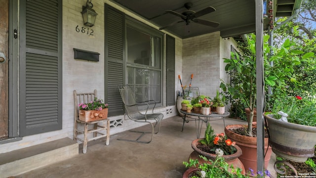 view of terrace with covered porch and ceiling fan