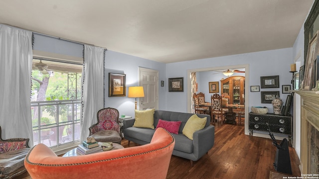 living room with ceiling fan and dark hardwood / wood-style floors