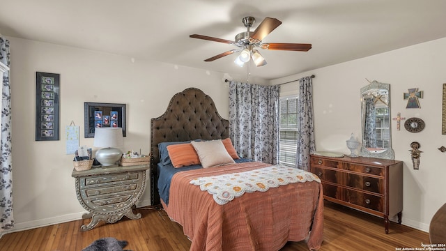 bedroom featuring wood-type flooring and ceiling fan