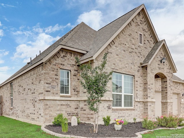 view of side of property featuring a garage