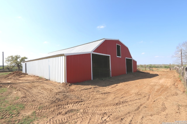 view of outdoor structure with a rural view