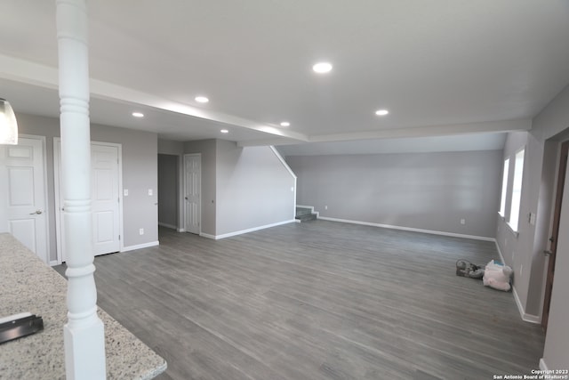 basement with dark hardwood / wood-style flooring