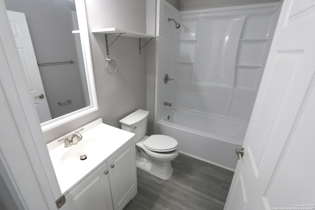 full bathroom with vanity, toilet, tub / shower combination, and hardwood / wood-style floors