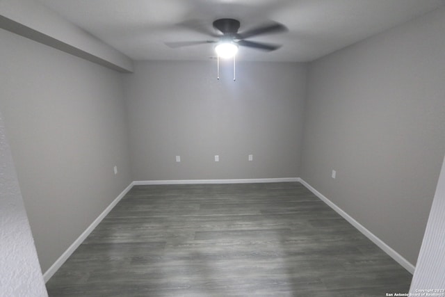 unfurnished room featuring ceiling fan and dark hardwood / wood-style flooring