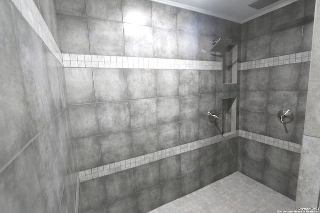 bathroom with tiled shower