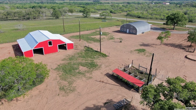 birds eye view of property with a rural view