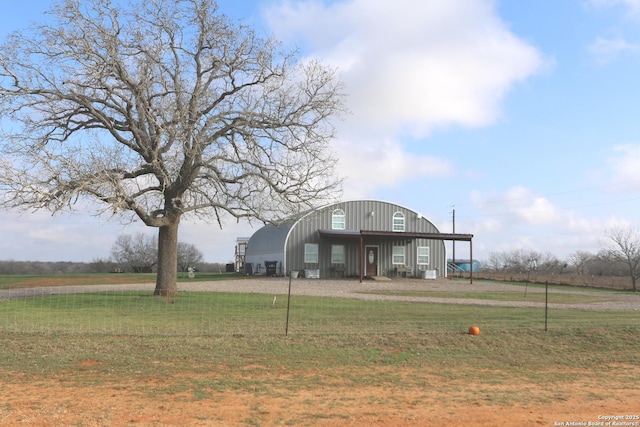 view of yard with a rural view