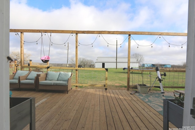 wooden deck featuring a yard and an outdoor hangout area