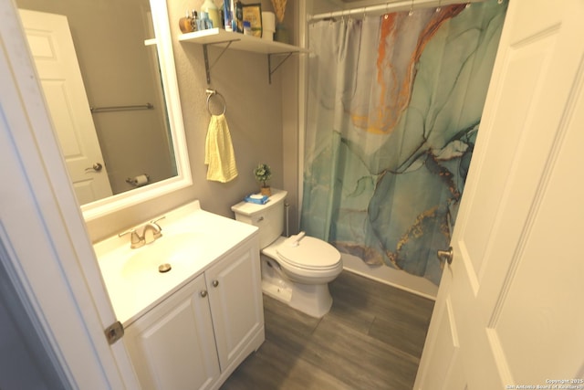 full bathroom featuring vanity, toilet, hardwood / wood-style floors, and shower / bath combo with shower curtain