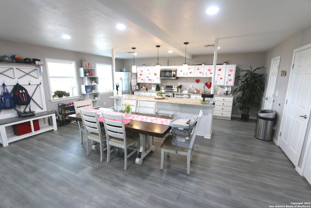 dining space featuring dark hardwood / wood-style floors