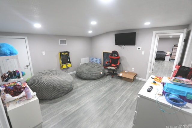 recreation room featuring light hardwood / wood-style floors