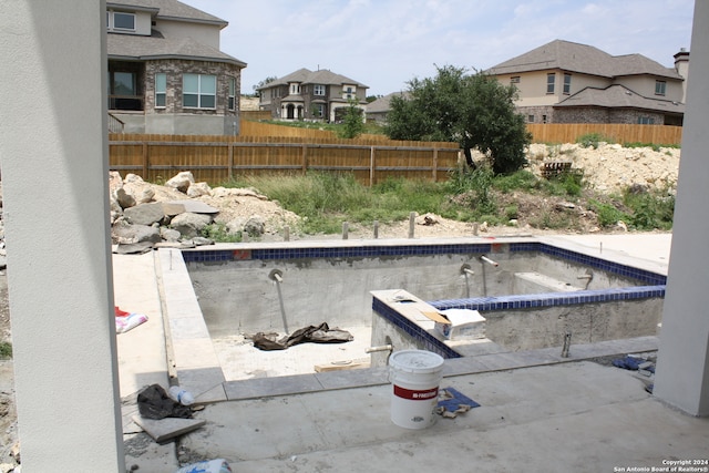 view of pool featuring a fenced in pool and fence