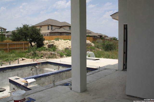 view of pool with a fenced in pool, fence, and a patio