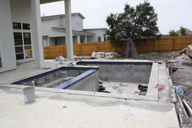 view of pool featuring a fenced backyard, a fenced in pool, and a patio