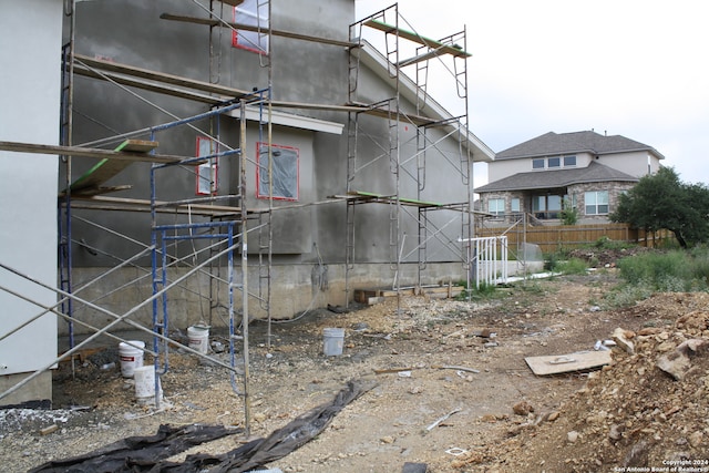 view of side of property with fence