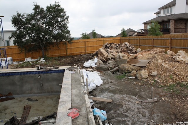 view of yard with fence and a fenced in pool