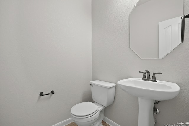 bathroom featuring toilet