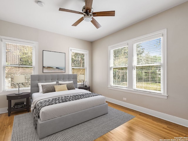 bedroom featuring ceiling fan and light hardwood / wood-style flooring