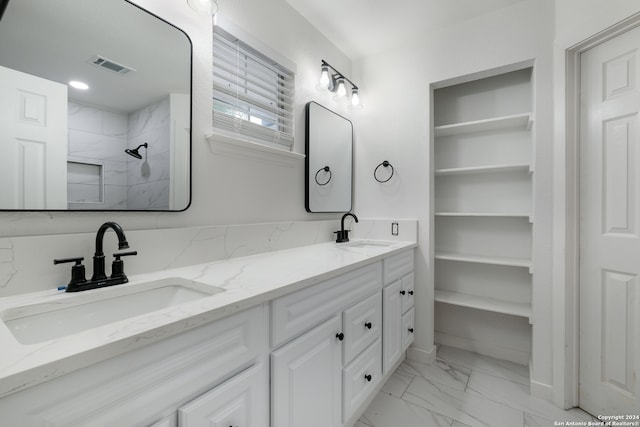 bathroom featuring large vanity, tile floors, and double sink