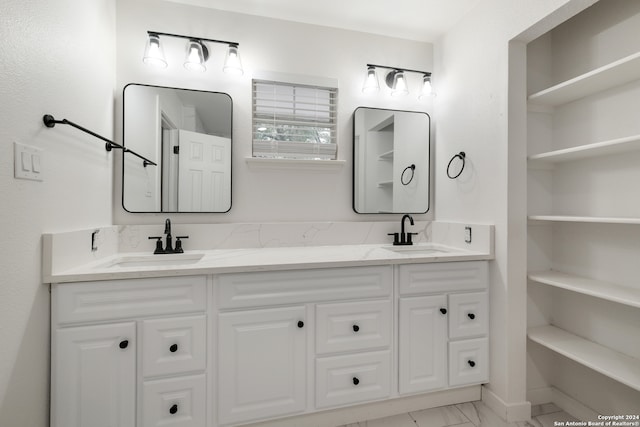 bathroom featuring dual bowl vanity and tile floors