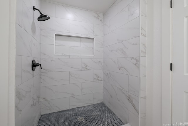 bathroom with tiled shower