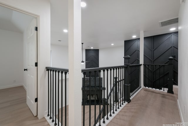 corridor with wood-type flooring