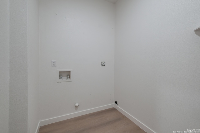 laundry room with hardwood / wood-style floors, hookup for a gas dryer, and hookup for a washing machine