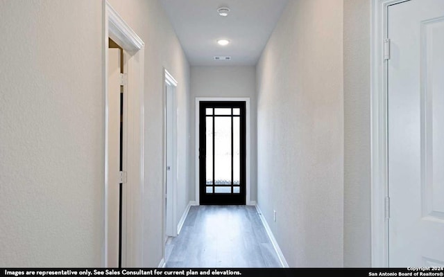 corridor featuring hardwood / wood-style flooring