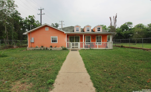 view of front of property with covered porch and a front yard