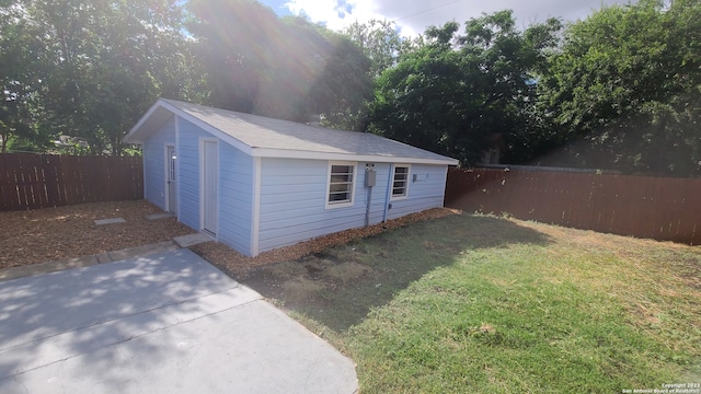 garage featuring a lawn