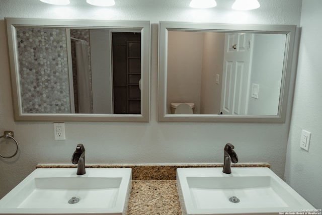 bathroom with dual vanity