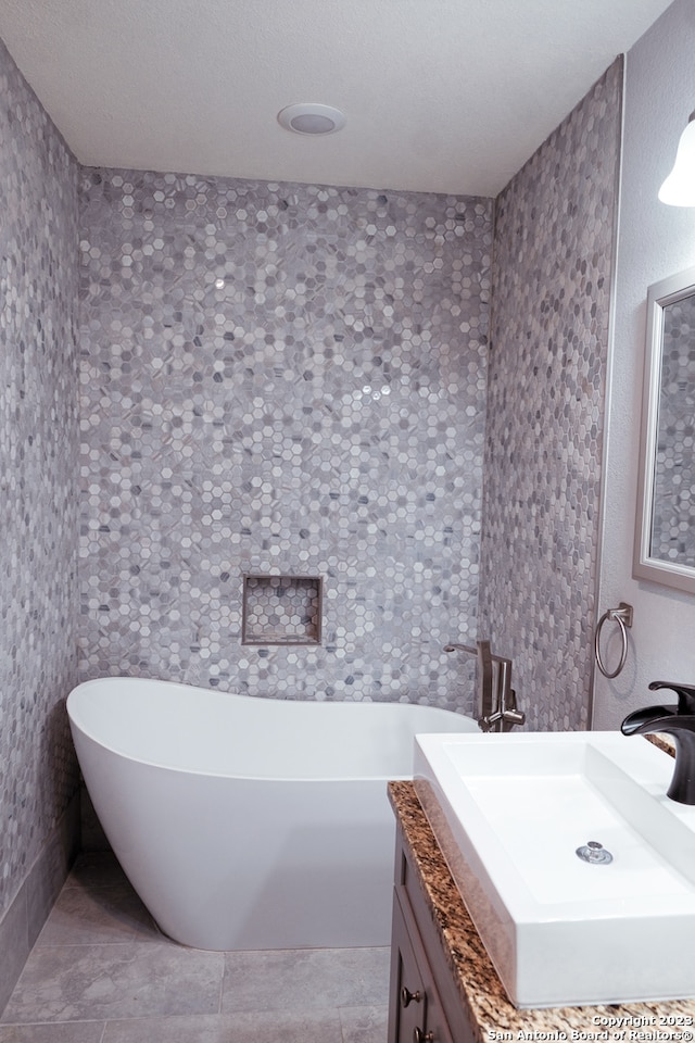 bathroom with vanity and tile floors