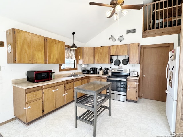 kitchen featuring decorative light fixtures, high vaulted ceiling, stainless steel appliances, sink, and ceiling fan