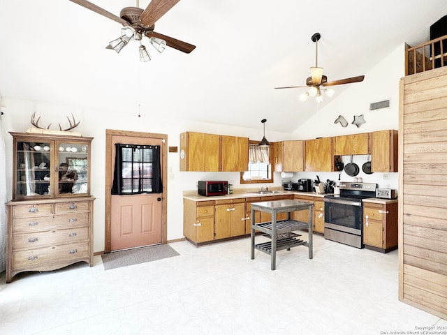 kitchen with ceiling fan, light tile floors, high vaulted ceiling, sink, and stainless steel appliances